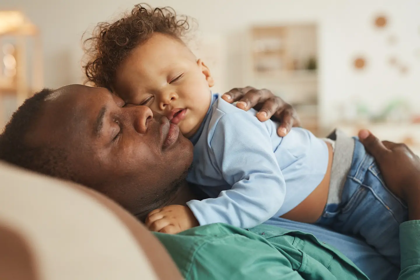 A father cuddles with his baby.